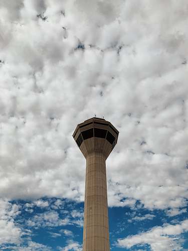 building beige tower under white cloudy sky australia