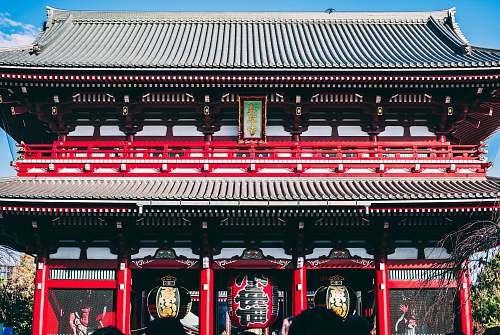 building black and red temple gate pagoda