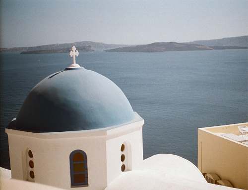 building blue and white church of Santorini, Greece dome