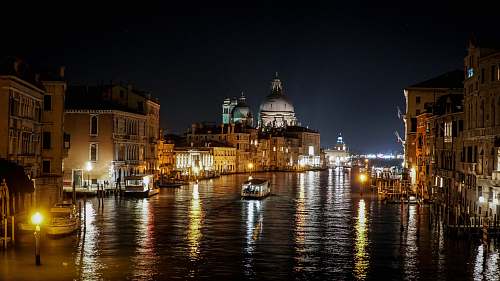 building boat on body of water during nighttime dome