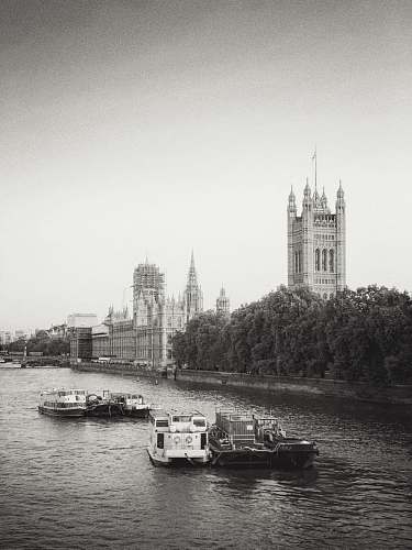 building boats sailing during daytime spire