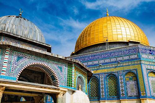 building brass-colored and blue dome building during daytime dome
