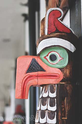building brown and multicolored bird wooden decor symbol