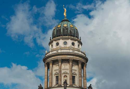 building brown and white tower under white and blue sky at daytime dome