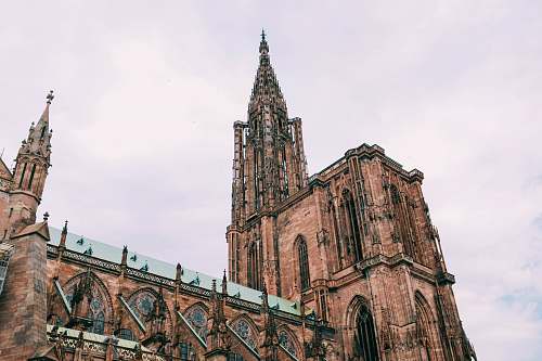 building brown cathedral during daytime spire