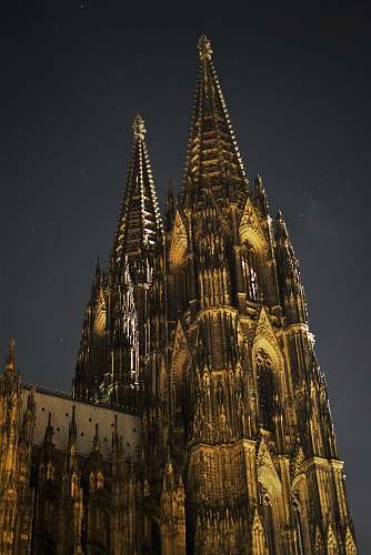 building brown concrete building during night spire
