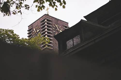 building brown concrete buildings tower