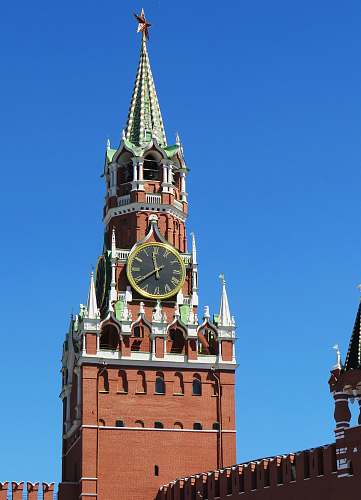 building brown, green and white clock tower tower
