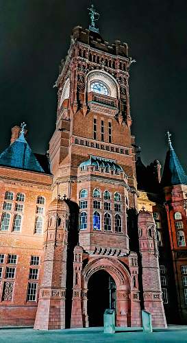 building brown tower clock at night tower