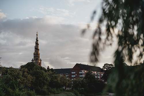 building brown tower during daytime spire