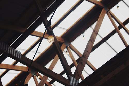 building brown wooden truss with clear roof window
