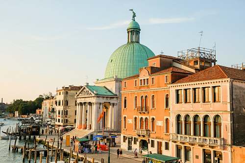 building buildings beside body of water at daytime dome