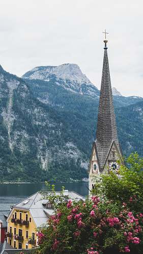 building cathedral with mountain at distance steeple