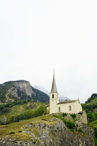 spire church on hill building