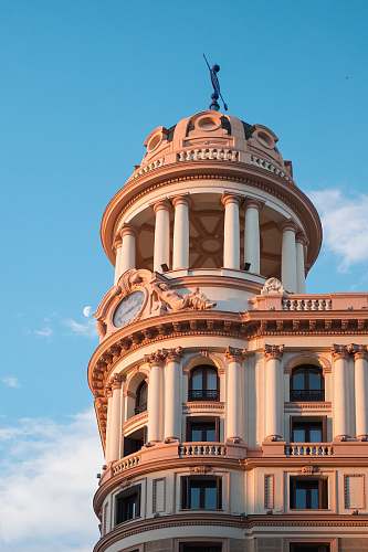 building clock tower under blue sky dome