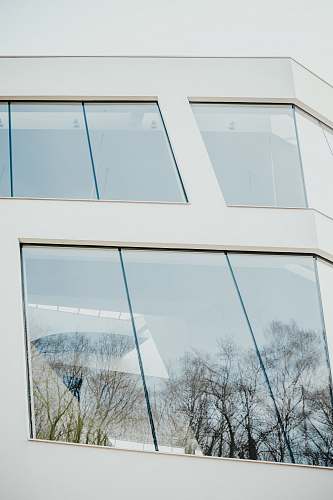 building closed clear glass windows of white building window