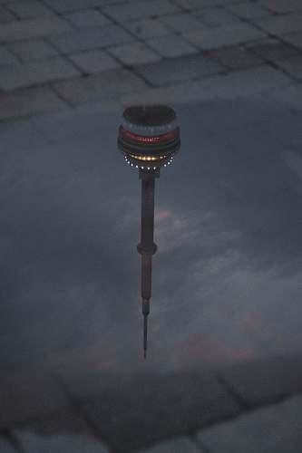building CN tower reflection on water tower