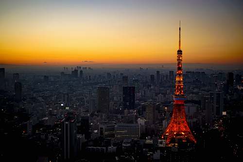 building Eiffel Tower near buildings spire