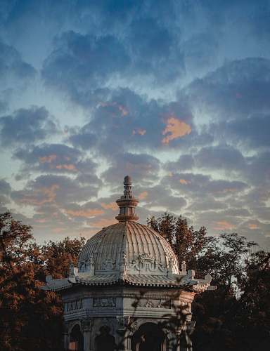 building Gothic gazebo under cloudy sky dome