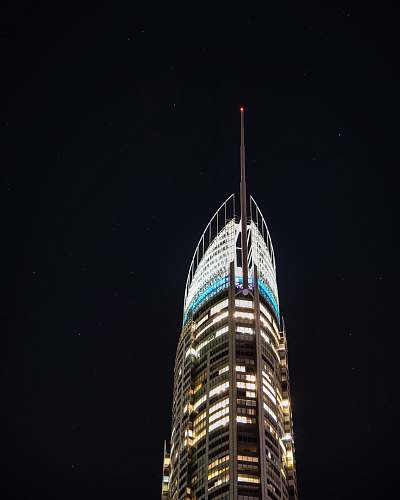 spire gray building under clear night sky tower
