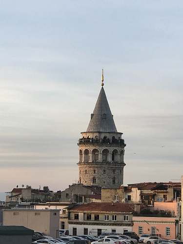 steeple gray concrete building at daytime tower