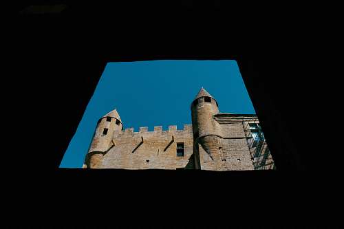 building gray concrete castle under blue sky castle