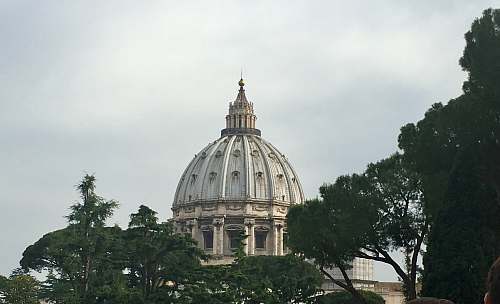 building gray dome building under white sky dome