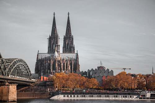 building gray twin tower spire