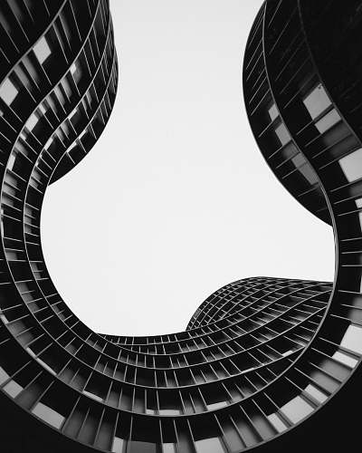black-and-white grayscale photo of low angle view of building spiral