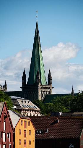 building green and grey church steeple spire