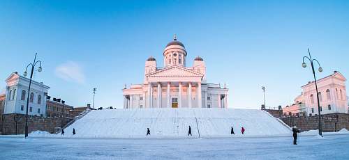 building group of people walking beside concrete hall dome