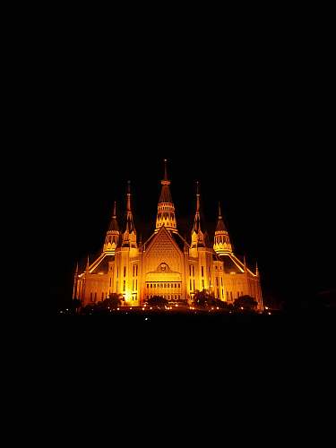 building lighted castle at night spire