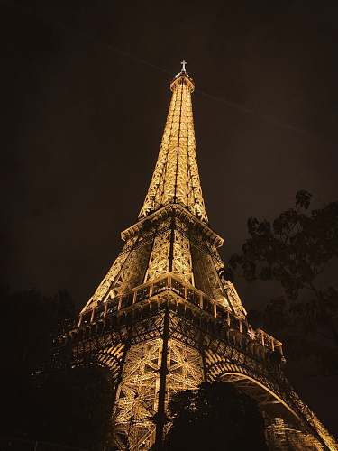 building lighted Eiffel tower during nighttime spire