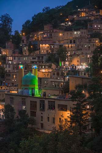 building lighted houses on hill dome