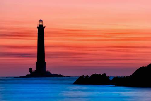 building lighthouse during golden hour tower