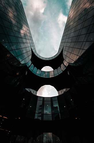 building low angle photography of architectural structure during daytime window