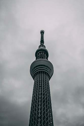 building low-angle photography of black concrete tower tower