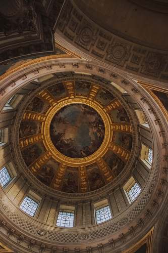building low-angle photography of building's ceiling paintings apse