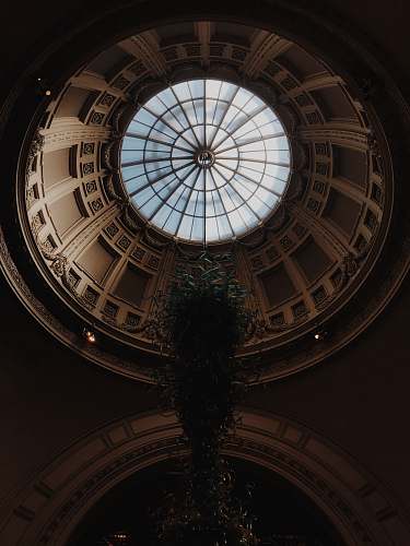 building low-angle photography of ceiling of dome building window