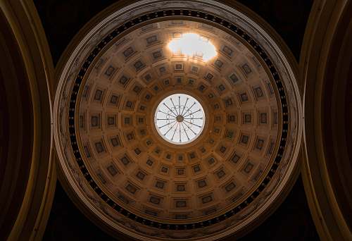 building low-angle photography of dome building ceiling window