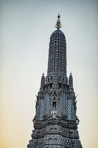 building low-angle photography of gray building spire