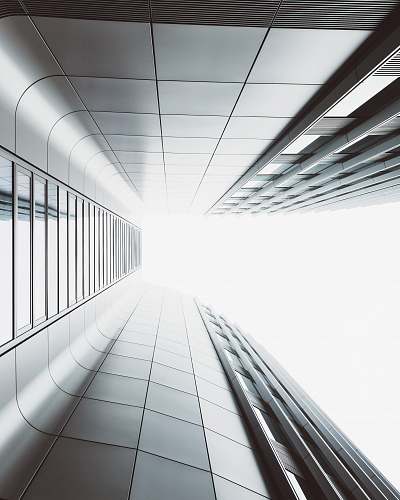 city low angle photography of high-rise building white