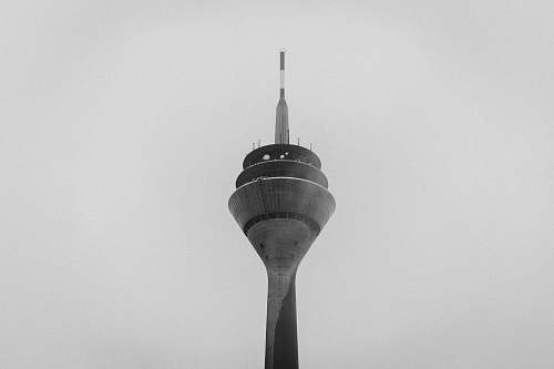 building low-angle photography of tower black-and-white