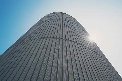 building low-angle photography of white high-rise building during daytime city