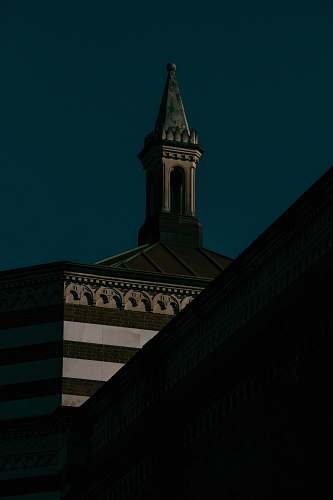building low-angled photography of white concrete building spire