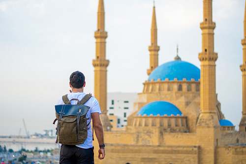 building man carrying backpack dome