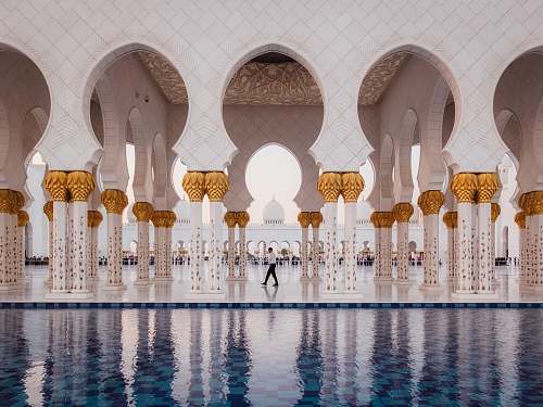 dome man walking on near swimming pool mosque