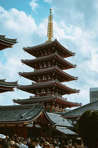 pagoda people gathering beside temple worship
