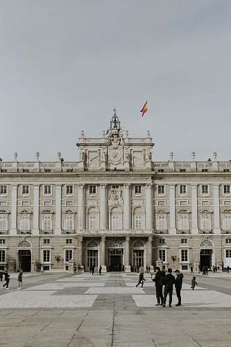 palace people walking near Royal Palace of Madrid house