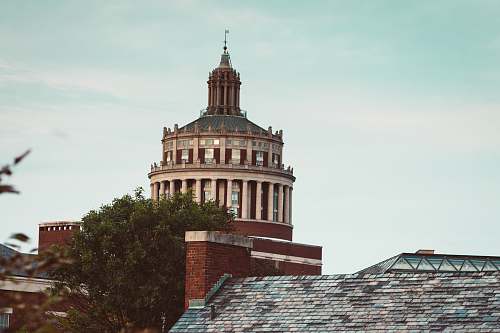 building photo of beige and maroon temple dome